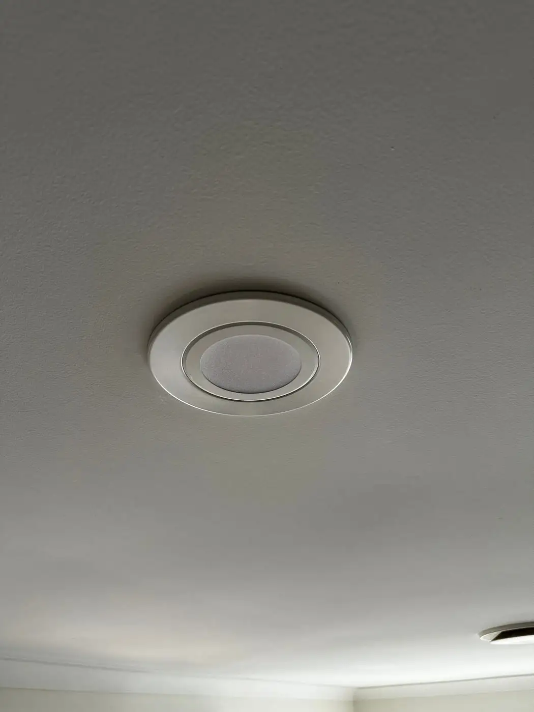 A finished LED downlight sitting flush in the ceiling